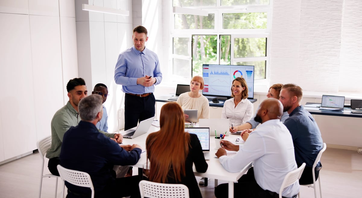 Company Inside Meeting In Office Boardroom Diverse Business Team