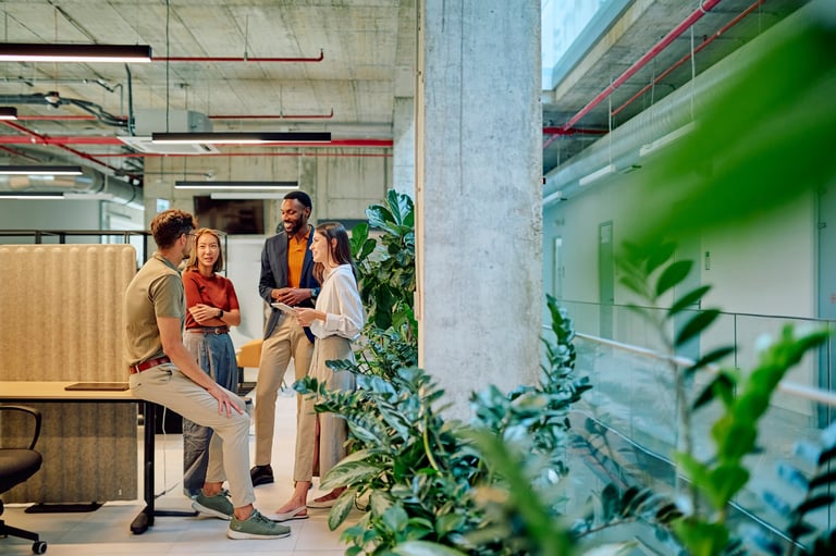 Group of diverse businesspeople engaged in discussion in a modern office
