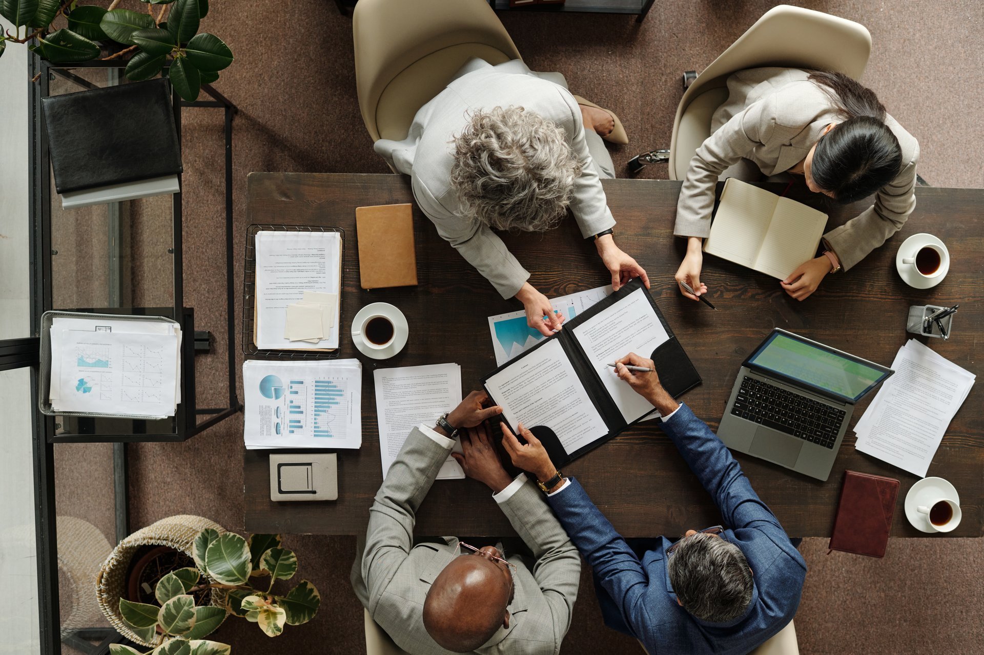 Group of business professionals collaborating around a table
